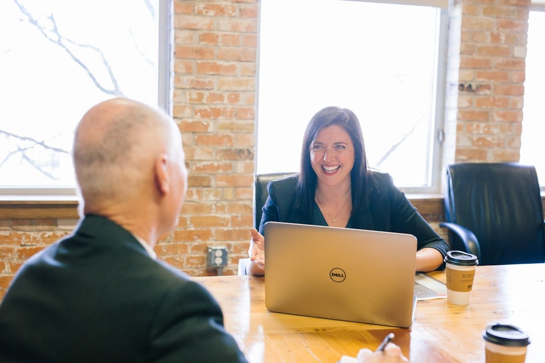 Manager and employee having a focused one-to-one conversation across a desk